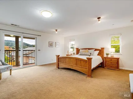 a bedroom with a bed and a night stand