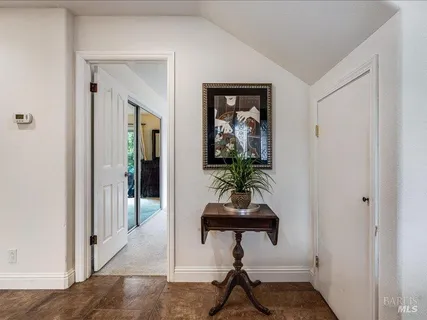 a room that has a mirror with furniture