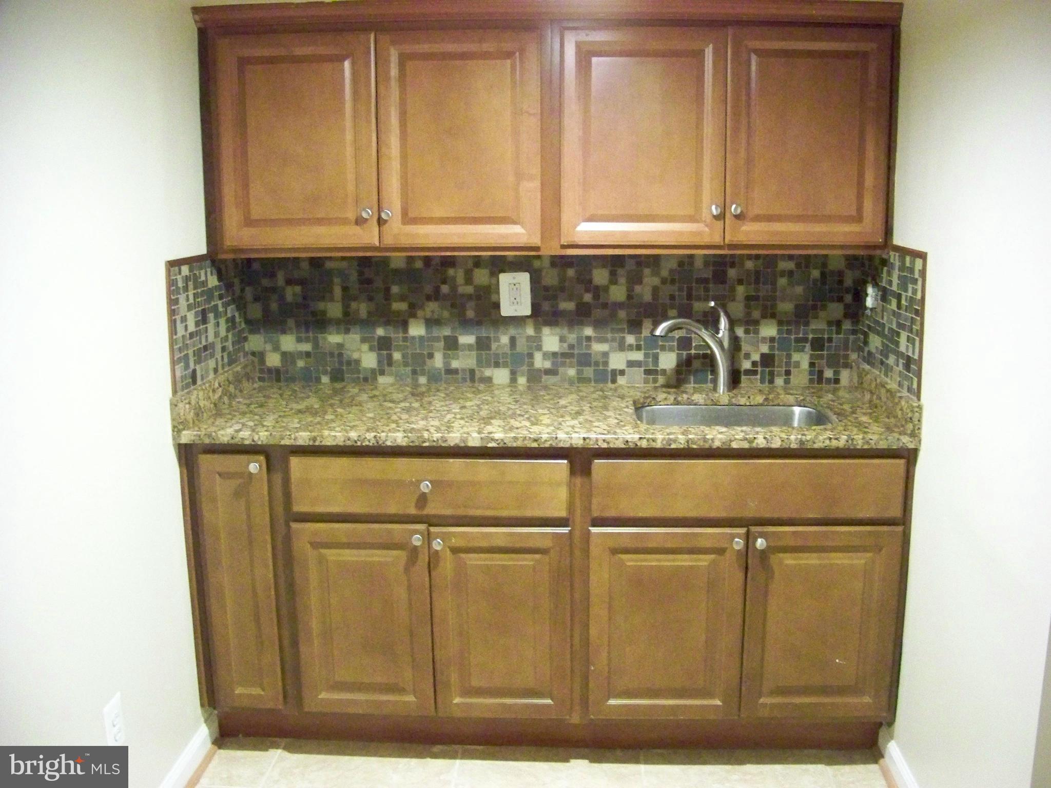 6016 Cipriano Road Lanham, MD 20706 - Photo 22 of 23 Basement Kitchenette / Wet Bar