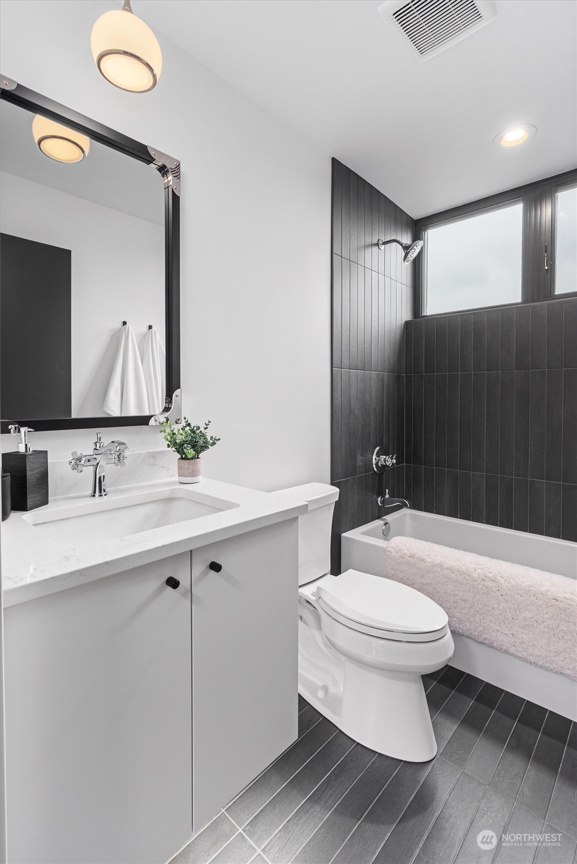 905 North 32nd Street Renton, WA 98056 - Photo 28 of 33 a bathroom with a double vanity sink toilet and shower