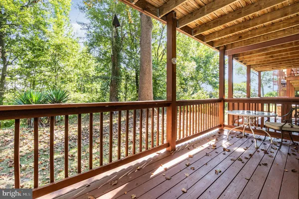 a view of balcony with wooden floor