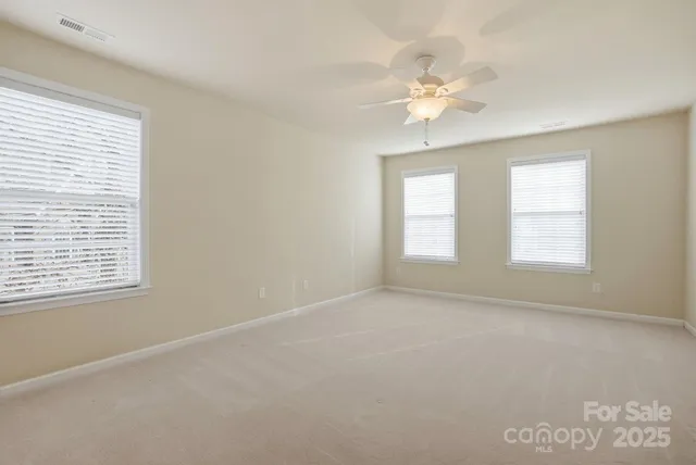 a view of a living room and floor to ceiling window