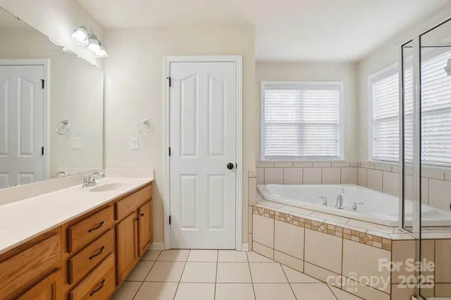 a view of a chair and table in backyard of the house
