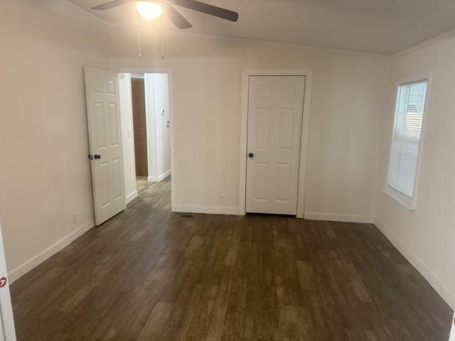 1100 Pine Top Road Toone, TN 38381 - Photo 25 of 40 Room featuring wood-finish flooring, white paneled doors, and a ceiling fan with integrated lighting