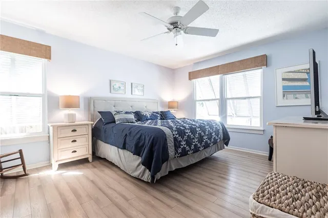 a bedroom with a large bed and a window