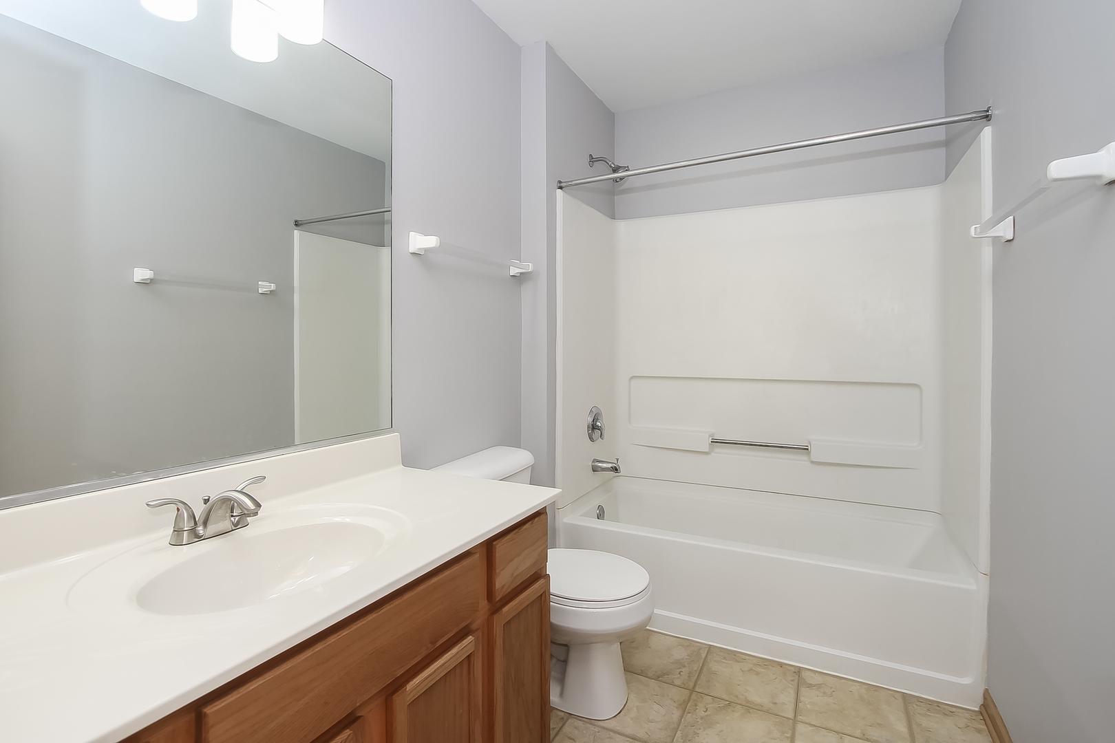 1640 McClure Road, Unit 1640 Aurora, IL 60505 - Photo 18 of 25 a bathroom with a sink a toilet and shower