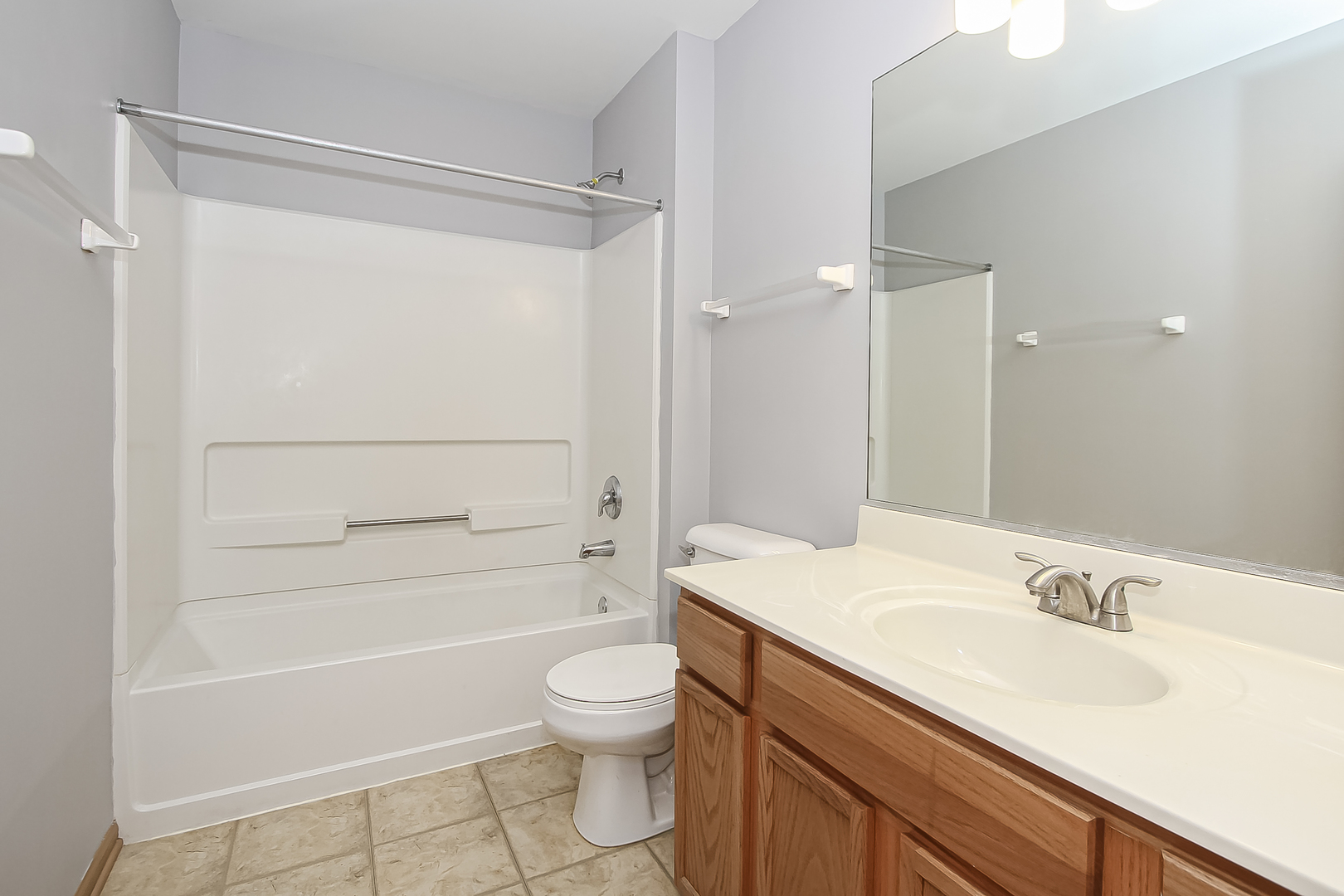 1640 McClure Road, Unit 1640 Aurora, IL 60505 - Photo 23 of 25 a bathroom with a sink a toilet and shower