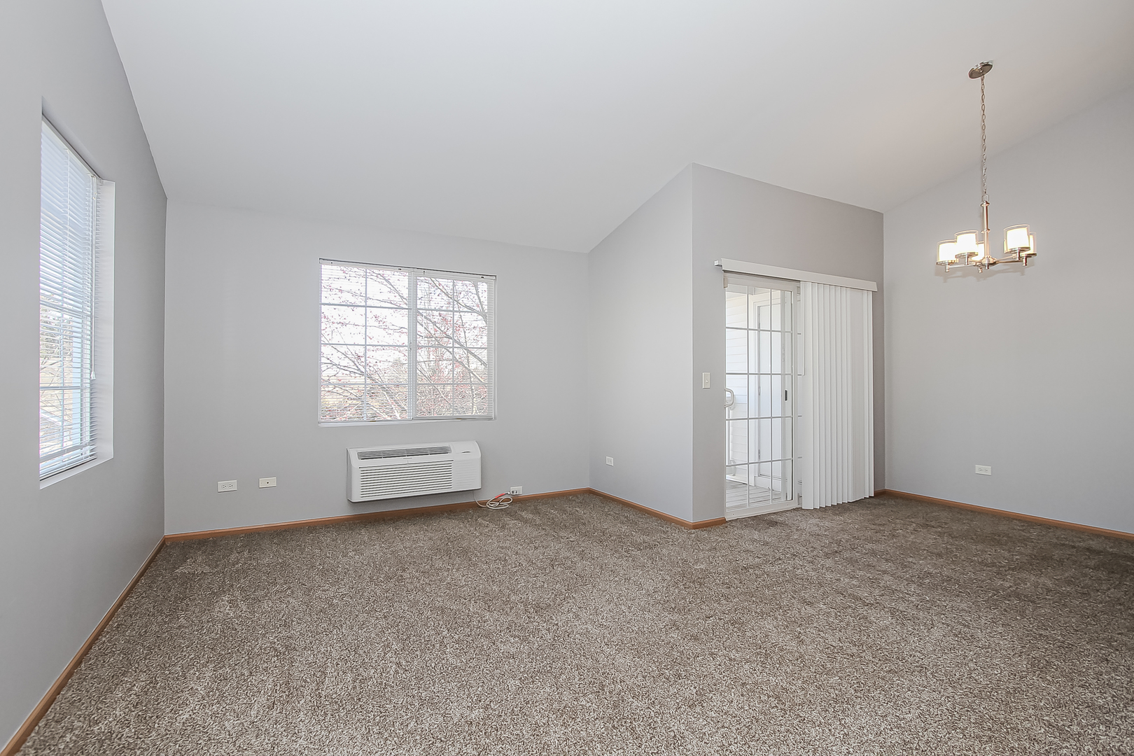 1640 McClure Road, Unit 1640 Aurora, IL 60505 - Photo 3 of 25 a view of an empty room with a window