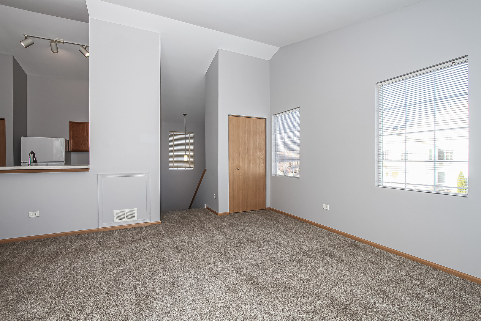1640 McClure Road, Unit 1640 Aurora, IL 60505 - Photo 5 of 25 a view of an empty room with a window