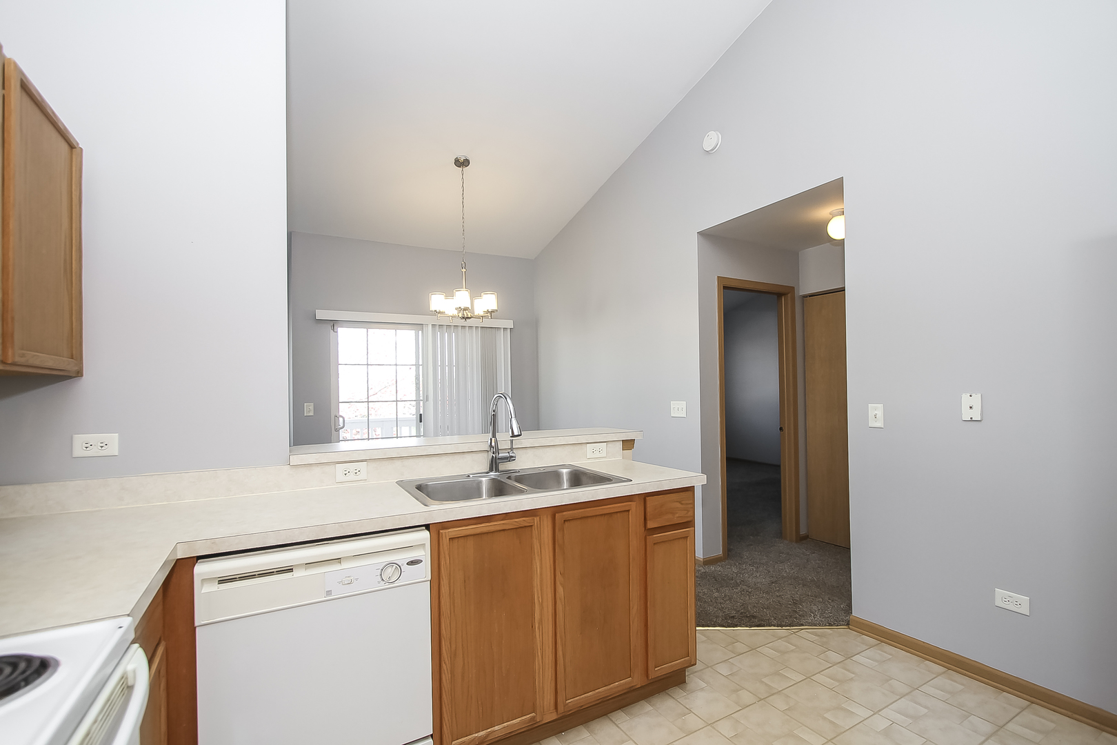 1640 McClure Road, Unit 1640 Aurora, IL 60505 - Photo 10 of 25 a kitchen with a sink stove and cabinets