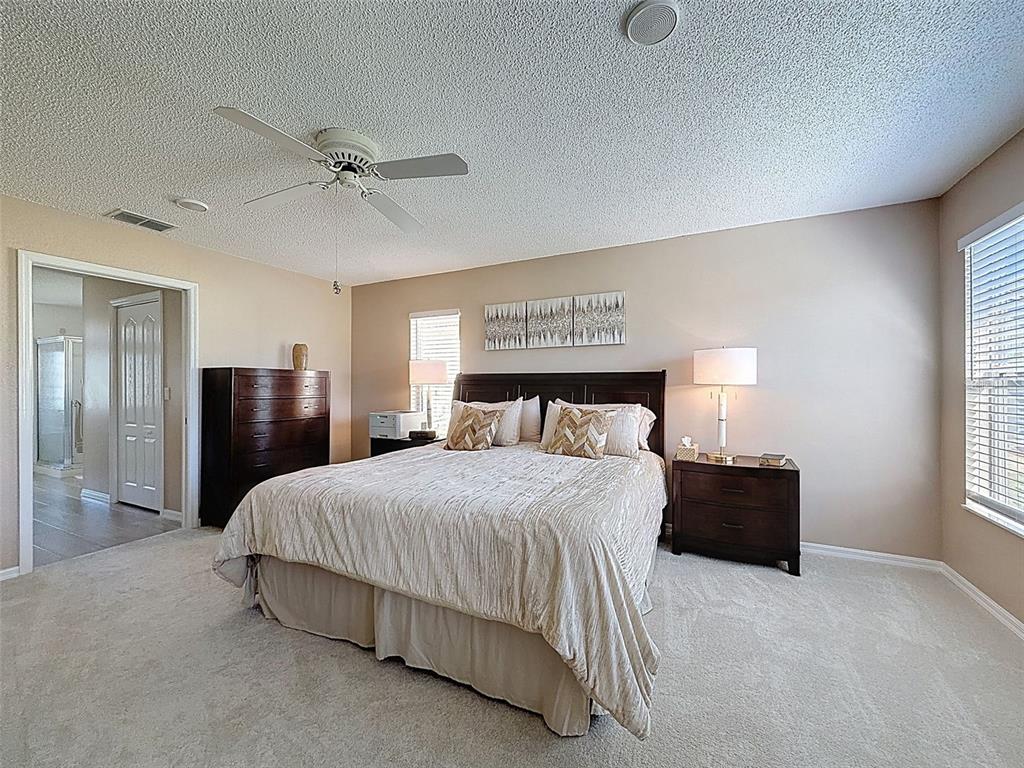9428 Apple Dumpling Court Weeki Wachee, FL 34613 - Photo 15 of 40 a bedroom with a bed and window