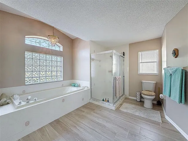 a bathroom with a bathtub sink and mirror