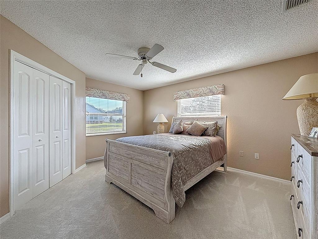 9428 Apple Dumpling Court Weeki Wachee, FL 34613 - Photo 26 of 40 a bedroom with a bed and a window