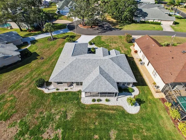 an aerial view of a house with swimming pool