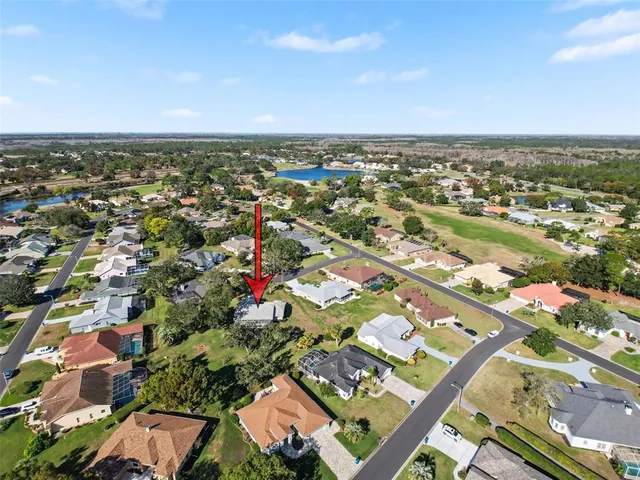 an aerial view of residential building with green space