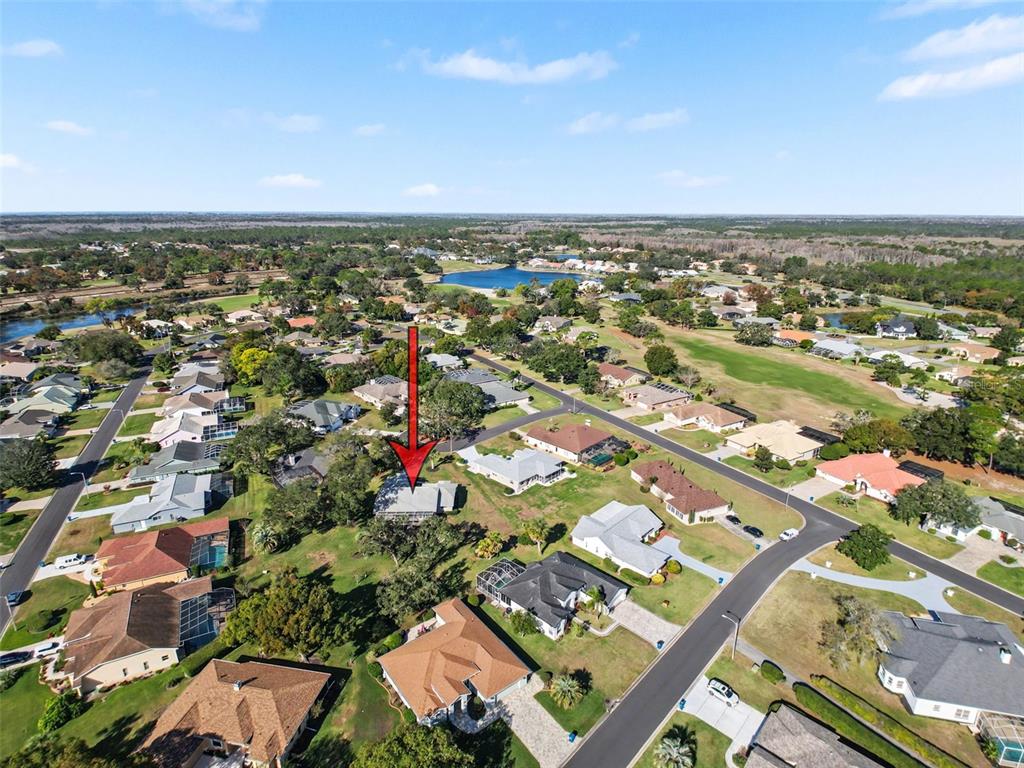9428 Apple Dumpling Court Weeki Wachee, FL 34613 - Photo 33 of 40 an aerial view of residential building with green space