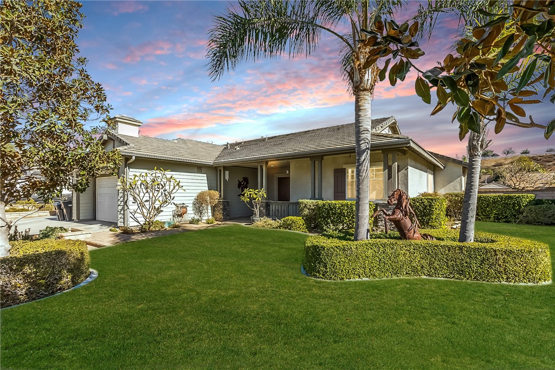 3047 Dapplegray Lane Norco, CA 92860 - Photo 3 of 28 a front view of a house with a garden