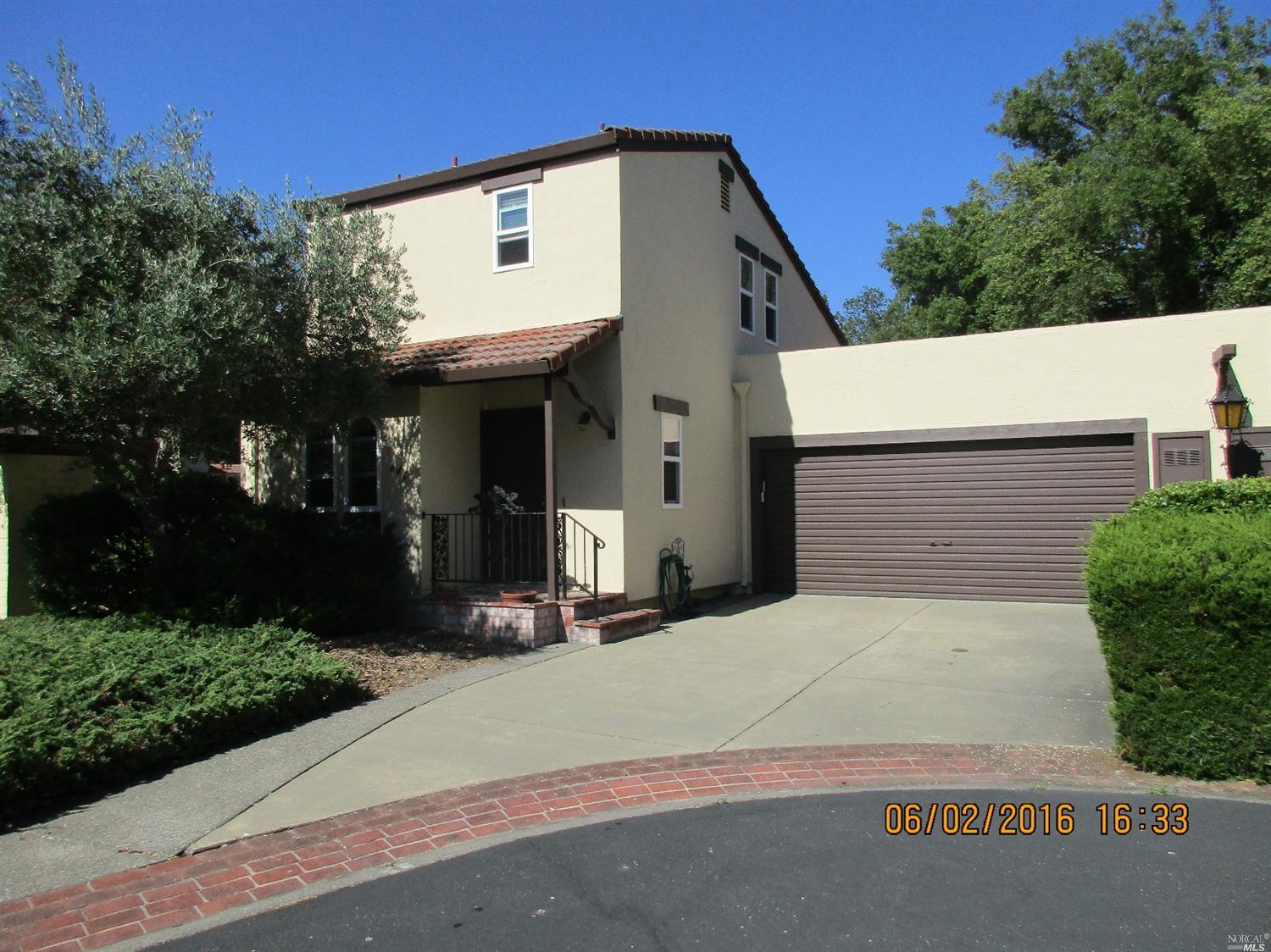 846 Adobe Drive Santa Rosa, CA 95404 - Photo 1 of 1 a front view of a house with a yard and garage