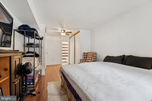 a bedroom with a bed and a walk in closet