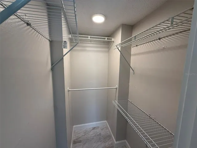 a view of a room with racks on the wall