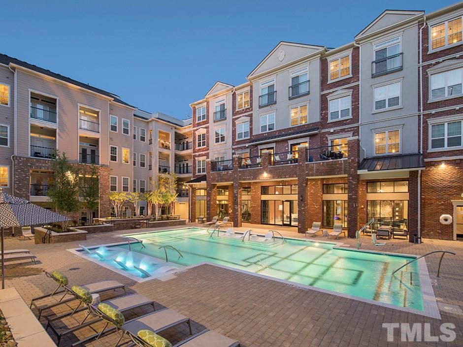 4700 Riverwood Circle, Unit 268 Raleigh, NC 27612 - Photo 1 of 22 a front view of a building with garden