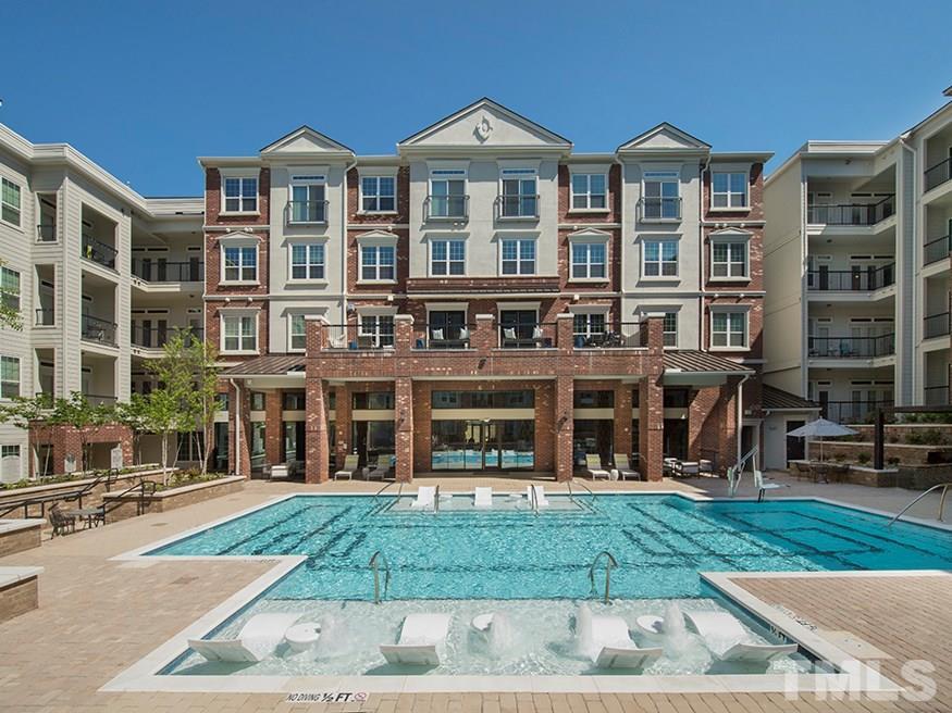 4700 Riverwood Circle, Unit 268 Raleigh, NC 27612 - Photo 21 of 22 front view of a building with a yard