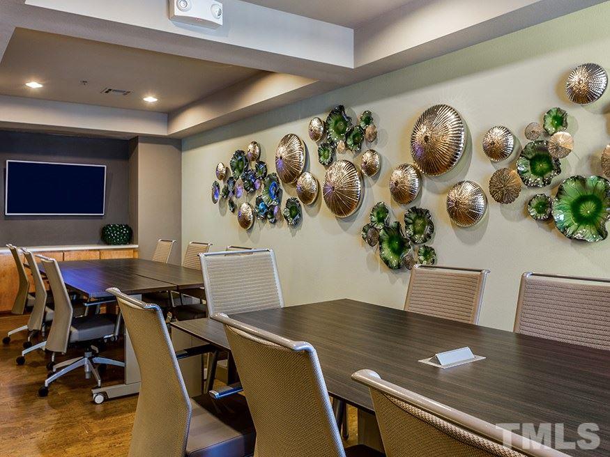 4700 Riverwood Circle, Unit 268 Raleigh, NC 27612 - Photo 5 of 22 a view of a workspace with furniture and wooden floor
