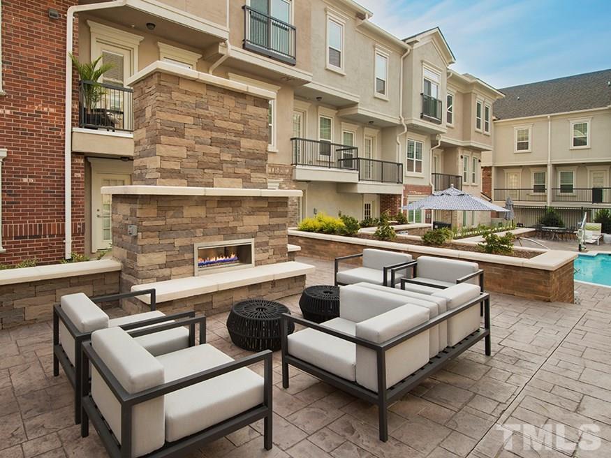 4700 Riverwood Circle, Unit 268 Raleigh, NC 27612 - Photo 6 of 22 a view of a patio with couches table and chairs