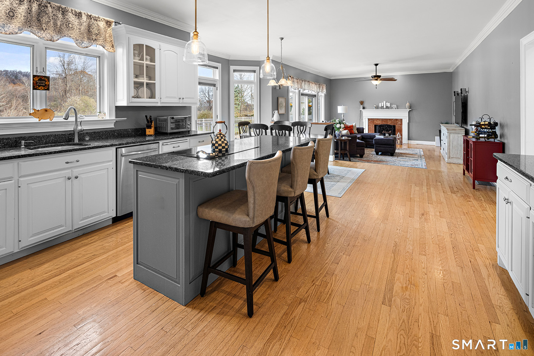 16 Marie Lane Wallingford, CT 06492 - Photo 11 of 40 a kitchen with stainless steel appliances granite countertop wooden floors stove top oven and cabinets