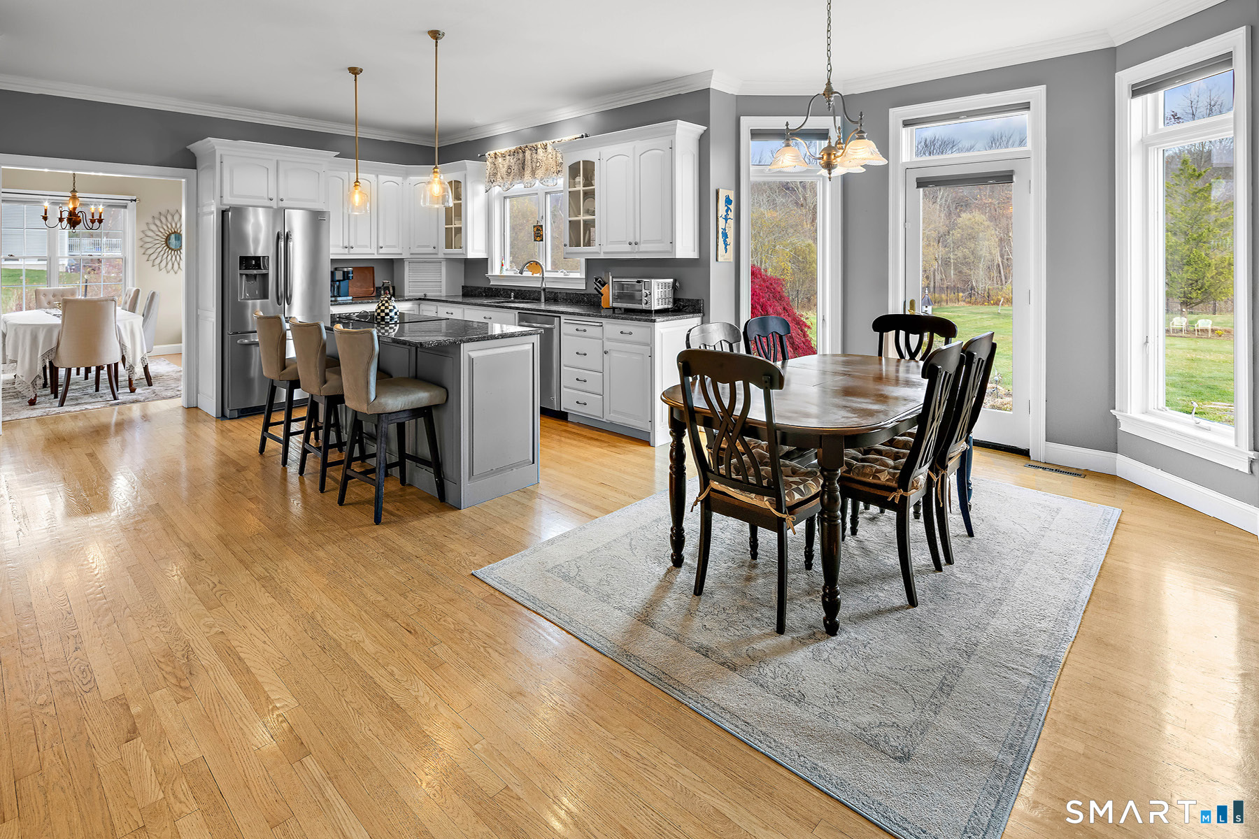 16 Marie Lane Wallingford, CT 06492 - Photo 13 of 40 a view of a dining room with furniture window and wooden floor