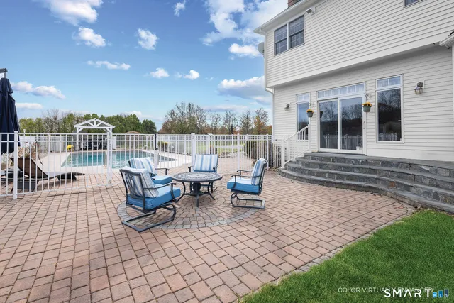 a view of a swimming pool with a lounge chairs