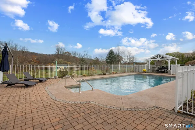 a patio with table and chairs