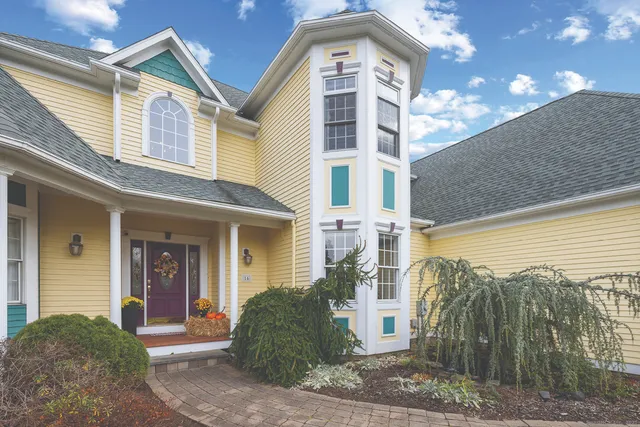 a front view of a house with a yard