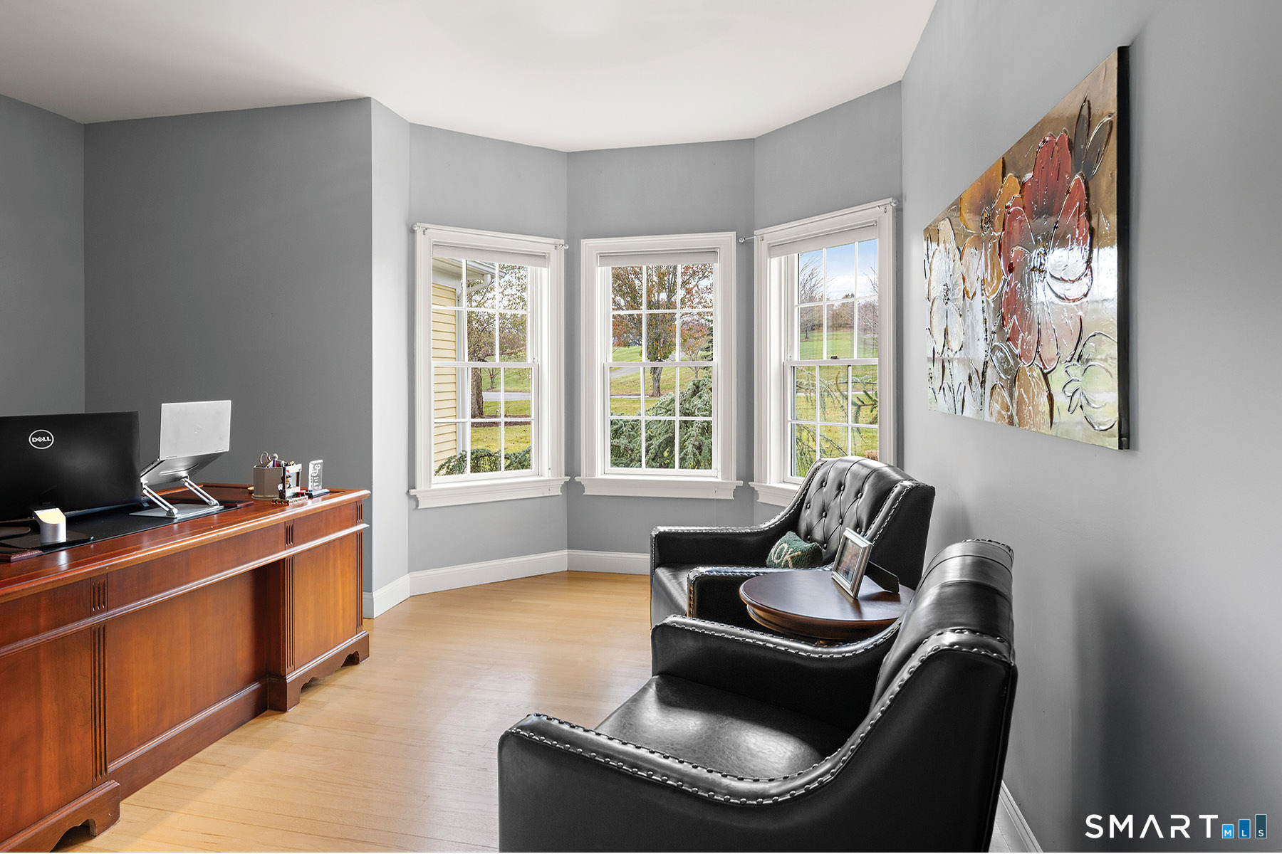 16 Marie Lane Wallingford, CT 06492 - Photo 22 of 40 a living room with furniture a flat screen tv and a window