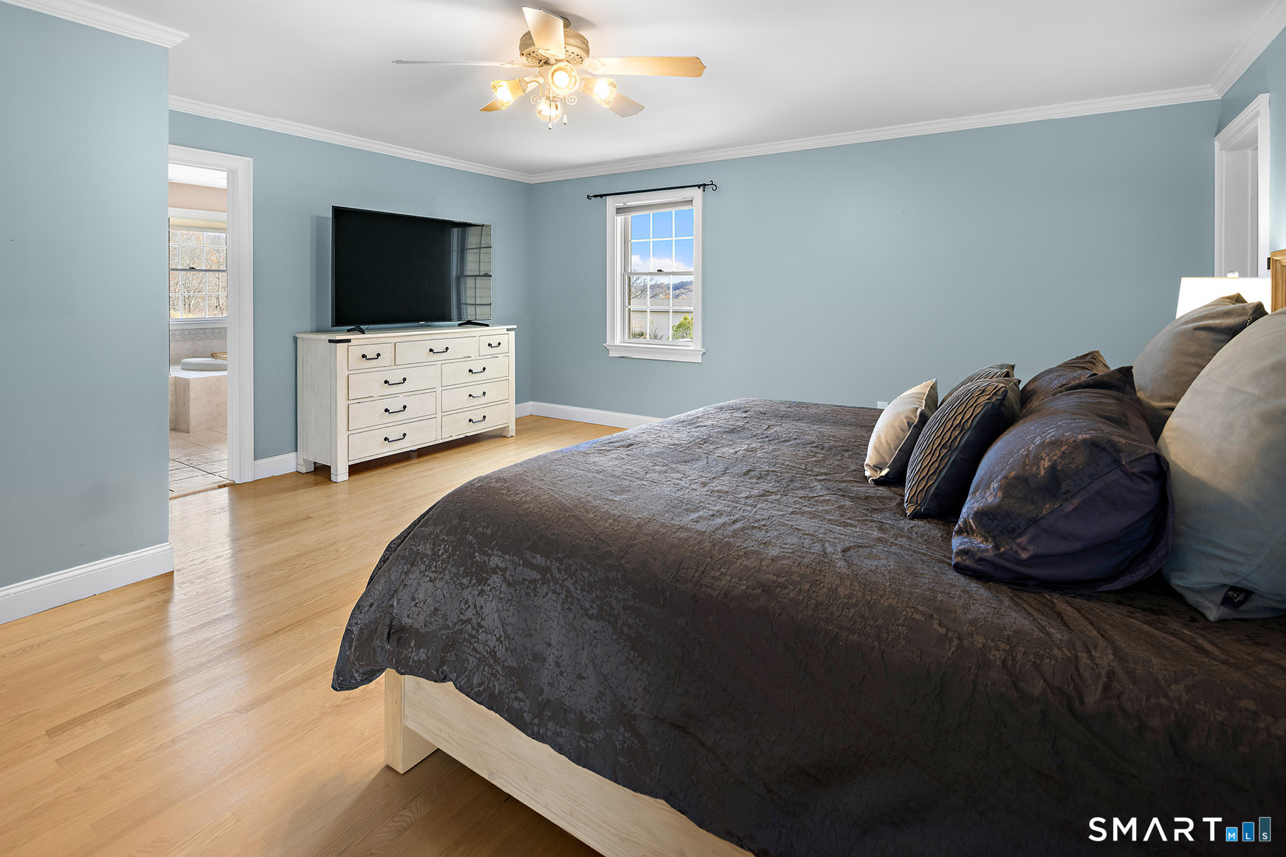 16 Marie Lane Wallingford, CT 06492 - Photo 26 of 40 a bedroom with a bed and a flat screen tv