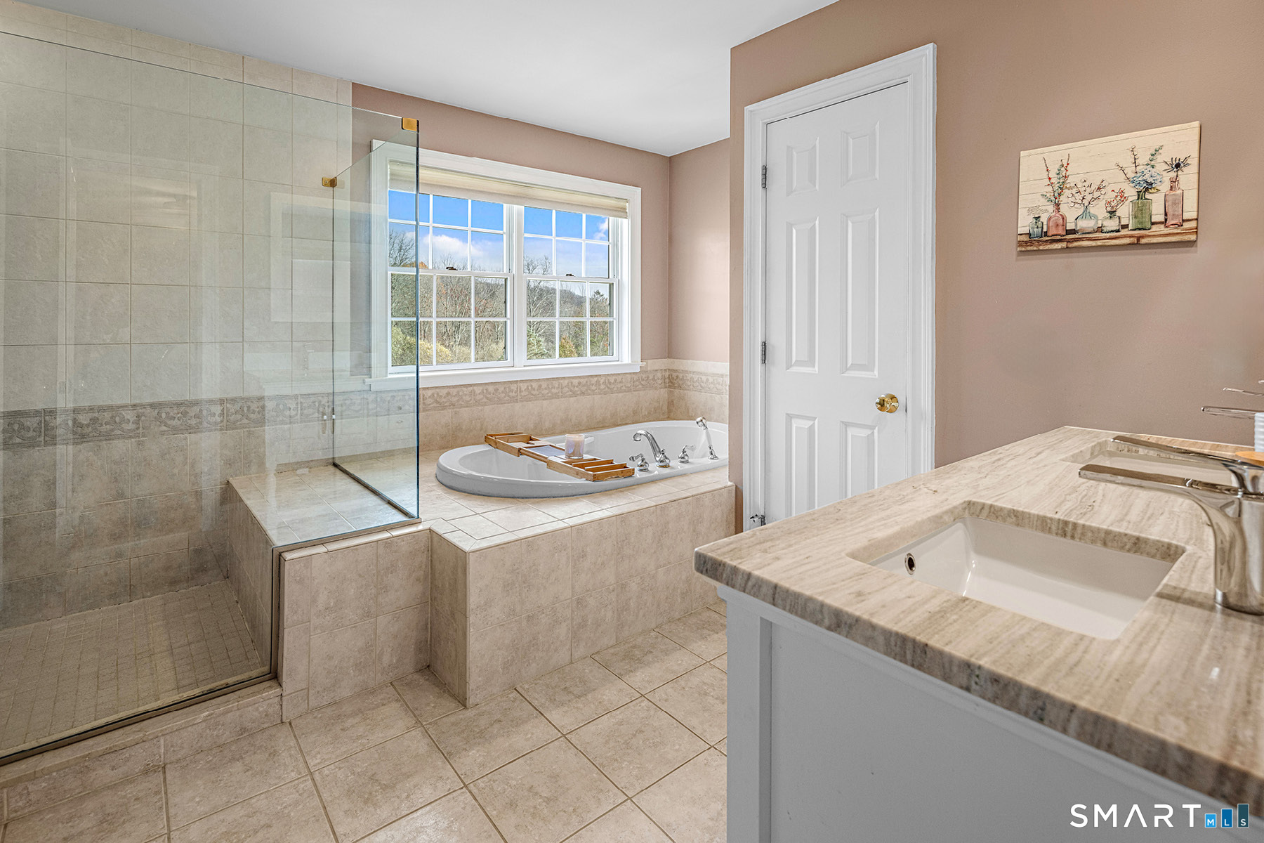 16 Marie Lane Wallingford, CT 06492 - Photo 27 of 40 a spacious bathroom with a granite countertop sink and a mirror