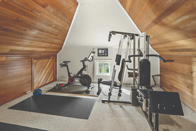 a view of gym equipment and windows
