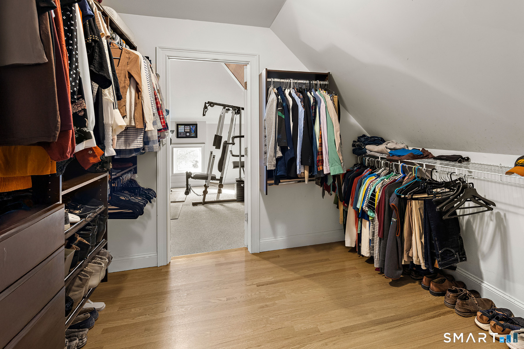 16 Marie Lane Wallingford, CT 06492 - Photo 30 of 40 a view of walk in closet with clothes and shoes