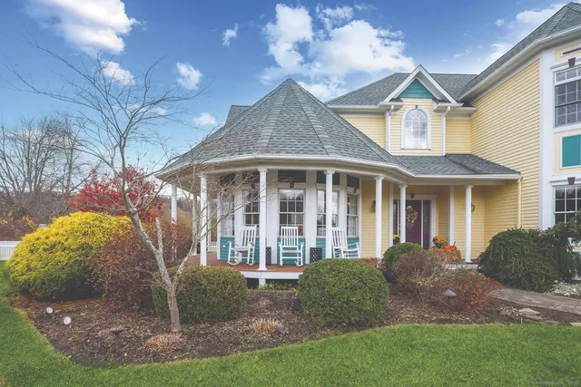 a front view of a house with a yard