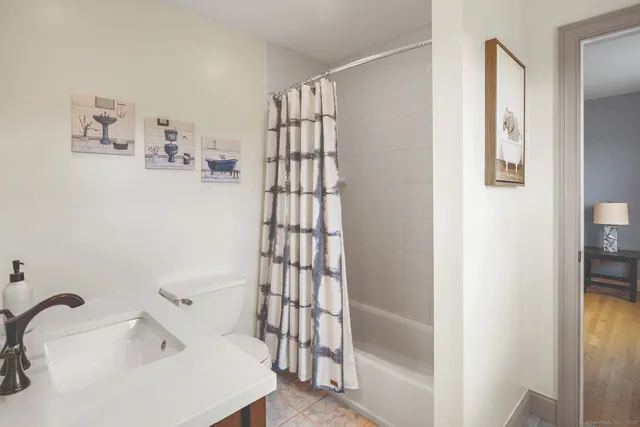 a bathroom with a bathtub and shower
