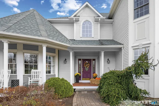 front view of a house with a yard