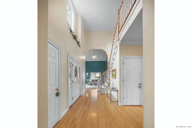 a view of a hallway with wooden floor