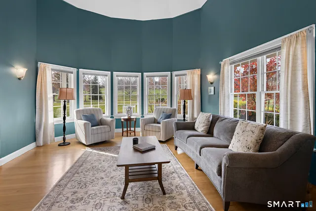 a view of a dining room with furniture window and outside view