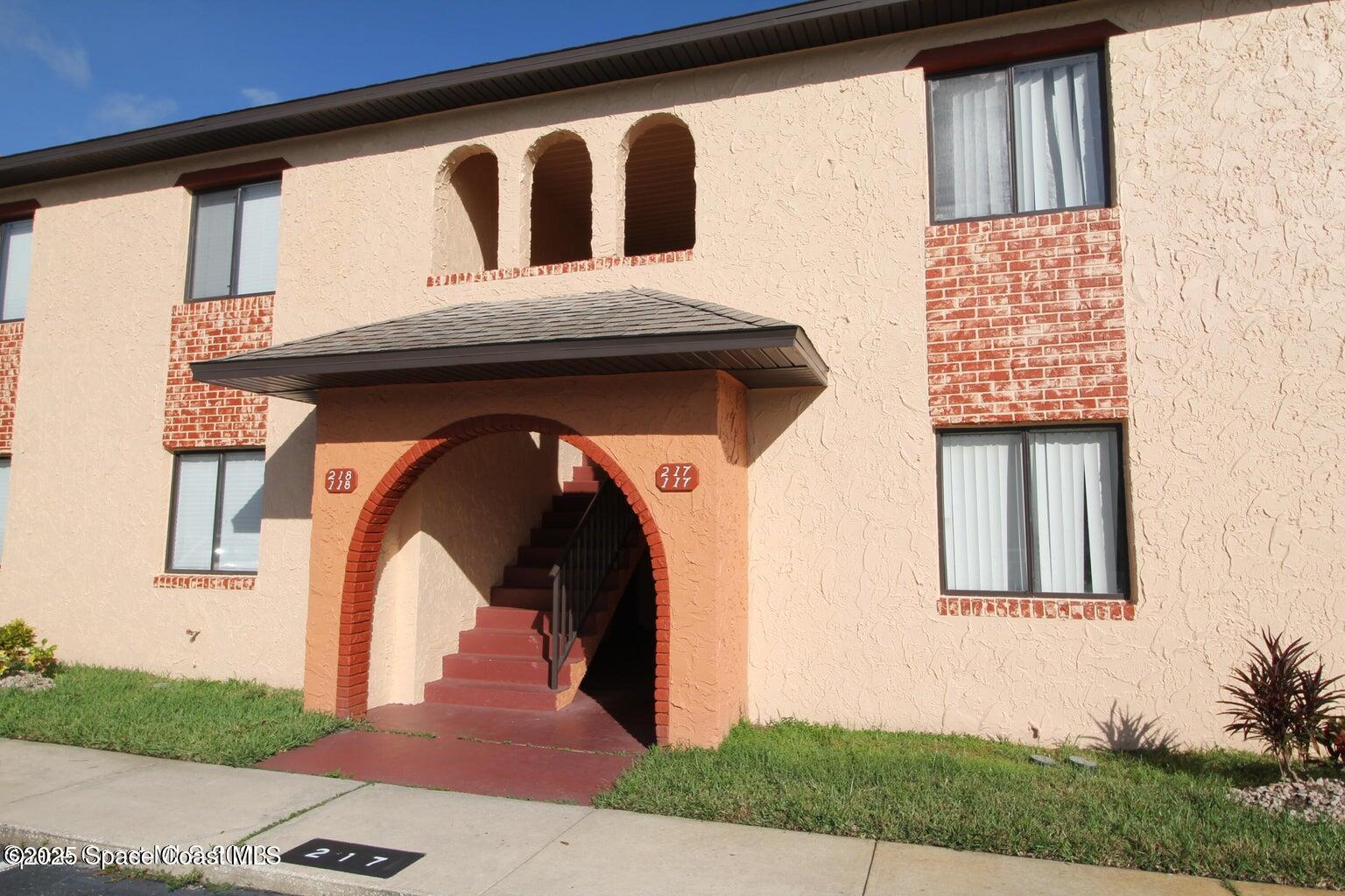 217 San Juan Circle Melbourne, FL 32935 - Photo 1 of 9 a front view of a house with garage