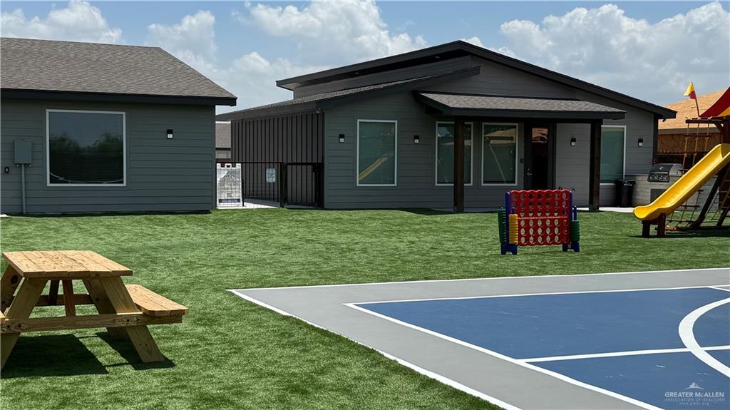 4004 Jenna Lane, Unit A Weslaco, TX 78599 - Photo 22 of 29 a view of a house with a yard