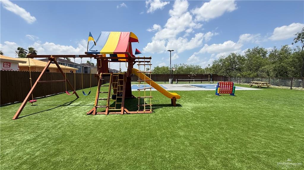 4004 Jenna Lane, Unit A Weslaco, TX 78599 - Photo 23 of 29 a view of a park with slide