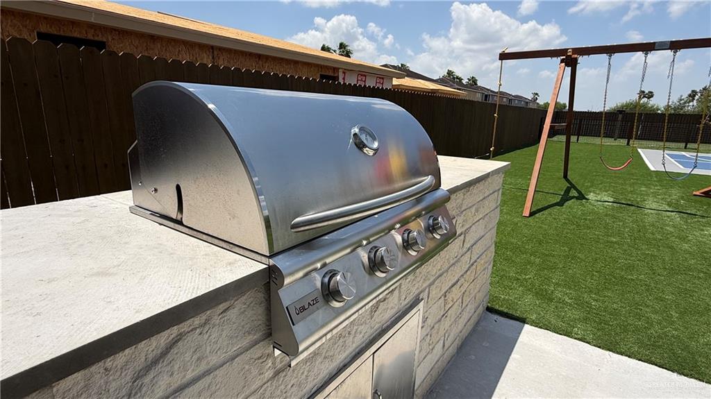 4004 Jenna Lane, Unit A Weslaco, TX 78599 - Photo 29 of 29 a roof deck with table and chairs