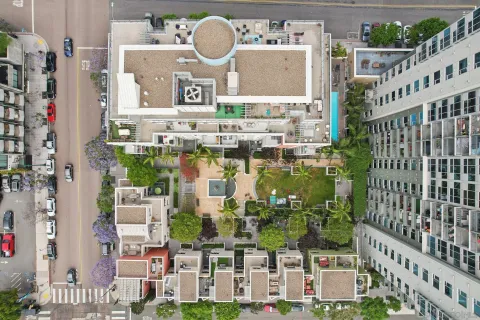 a backyard of a house with table and chairs