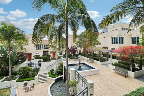 a view of a patio with table and chairs and potted plants