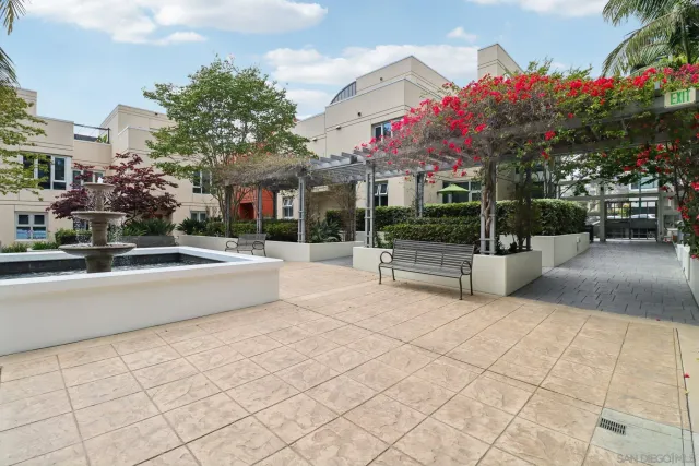 a kitchen with granite countertop a stove and cabinets